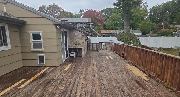 Freshly cleaned and sealed decking engineered to repel moisture and withstand harsh seasonal weather.