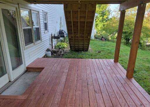 Freshly sealed down deck platform featuring smooth, splinter-free floorboards and reinforced safety railings.