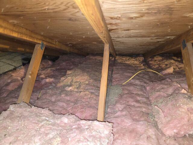 Old Attic Insulated with Fiberglass
