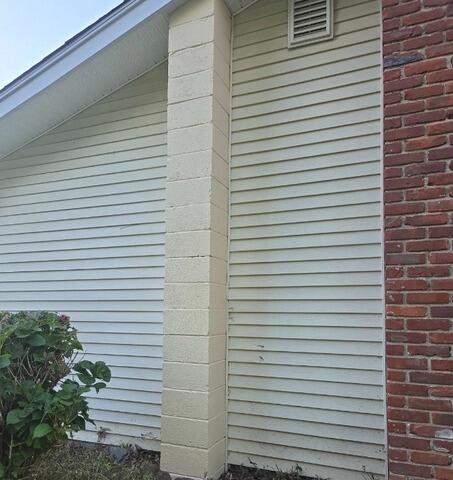 Freshly painted concrete block chimney and cleaned vinyl siding restored to perfection in Milford, CT.