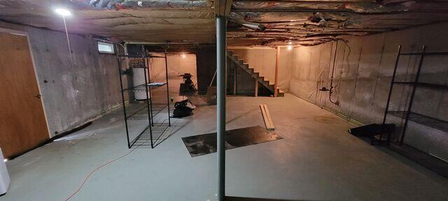 Basement with Bowing Walls and Water Intrusion