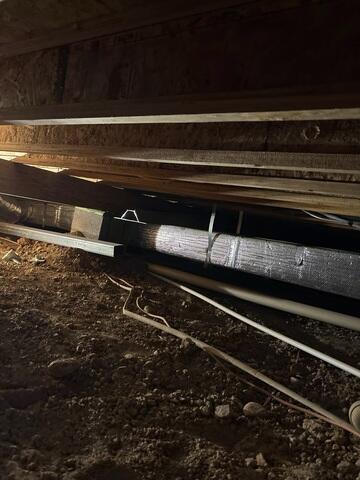 Supplemental Steel Beam Preparation Beneath the Home
