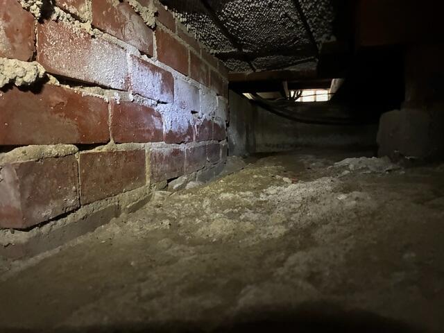 Exposed Masonry and Soil Before Crawl Space Encapsulation