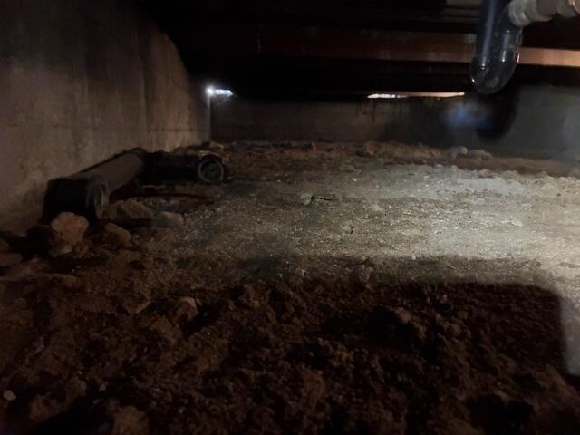 Bare-Earth Crawl Space Before Moisture Control Installation