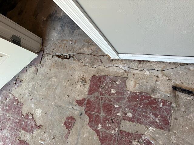 Cracked Concrete at a Doorway Before Repair