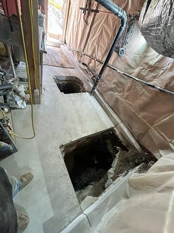 Foundation Repair Access in a Narrow Utility Area