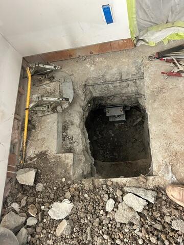 Push Pier Bracket Installation Beneath an Interior Floor