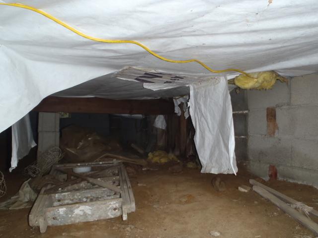 These homeowners had the right idea when they decided to get their crawlspace encapsulated, but used the wrong method. Vapor barriers should always be on the ground, never attached to the underside of a home. When attached to the underside of a home, moisture is trapped in the wood, causing mold, rot, and attracts termites. This means you can expect to be replacing the floors of your home much sooner than ever anticipated. Dr. Energy Saver will give you a free inspection of you crawlspace and a free estimate on how we can properly encapsulate your crawlspace. This will include a sump pump, our patented CleanSpace® vapor barrier and a dehumidifier. Together, this system will improve the floor temperature, reduce the amount of allergens and asthma triggers in your home, and prevent mold and termites.