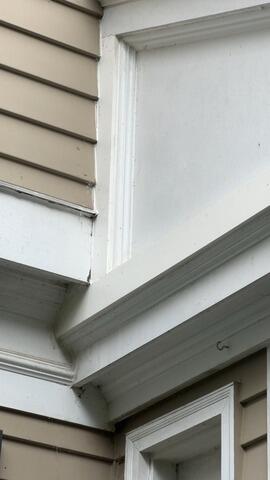 After restoration: Fully sealed, recaulked, and painted trim joints providing total moisture protection.