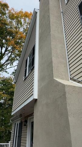 Complete exterior chimney stucco resurfacing and weatherproofing application.