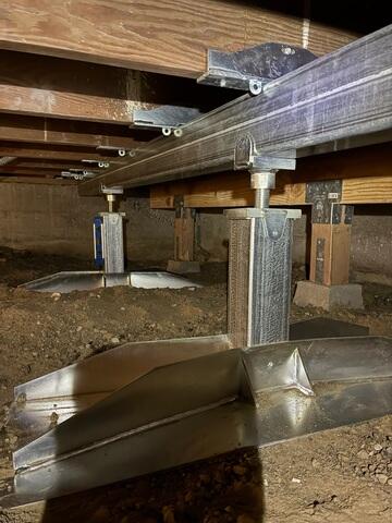 Installed SmartJack Supports Beneath the Steel Beam