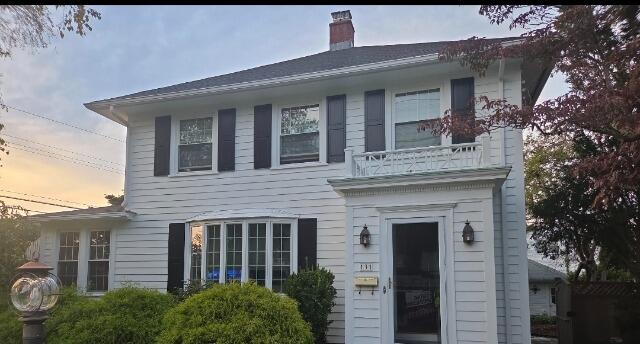 Beautifully restored front facade featuring fresh premium exterior paint and sharp black accent shutters.
