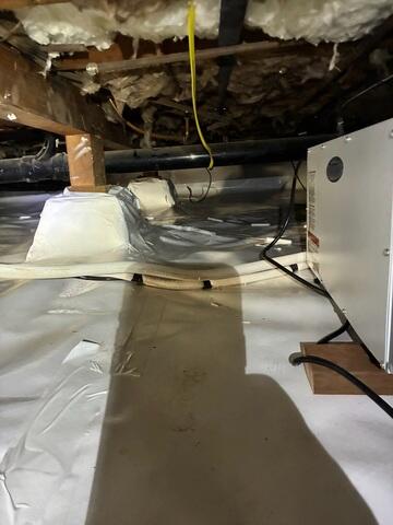 Vapor Barrier Fitted Around Crawl Space Support Bases