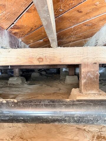 Existing Crawl Space Supports Before Vapor Barrier Installation