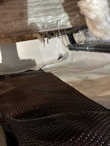 Crawl Space Vapor Barrier Installation in Progress