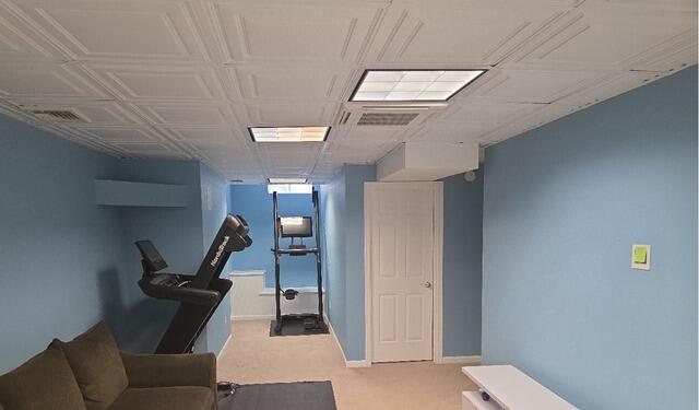 After: Vibrant blue accent walls creating a modern, cohesive look throughout the entire basement.