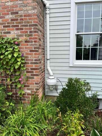 Exterior Radon Fan and Vent Pipe - After