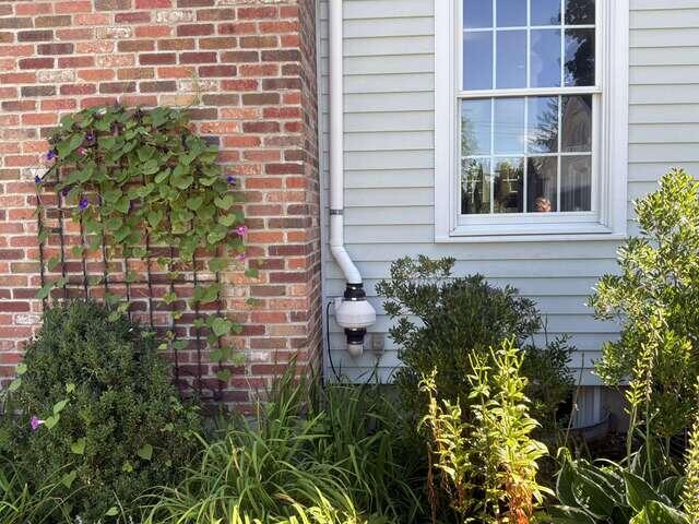 Exterior Radon Fan and Vent Pipe - Before