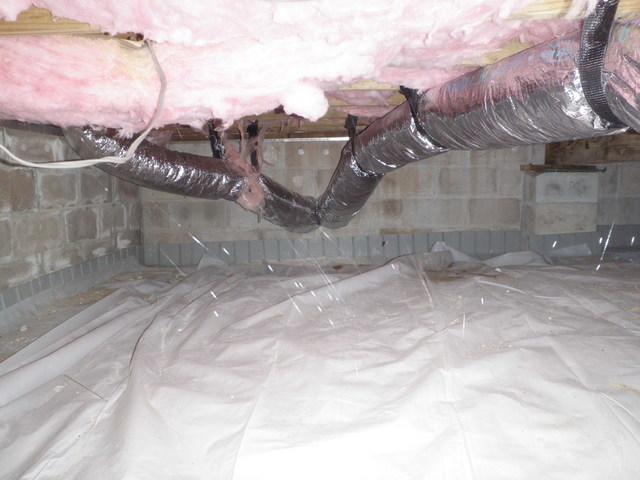 The moisture allowed in this crawlspace is trapped in the batted fiberglass insulation and is weighing it down. This leaves gaps in the rim joists, allowing cold air to rise up into the home through the floor in the winter. Dr. Energy Saver's patented CleanSpace® System removes the need for any insulation on the crawlspace ceiling, leaving floors warmer in the winter. This will also keep the wood dry, preventing mold, termites, and allergens from entering into your home.