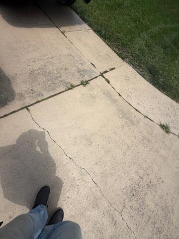 Concrete Driveway Cracks & Settlement Damage