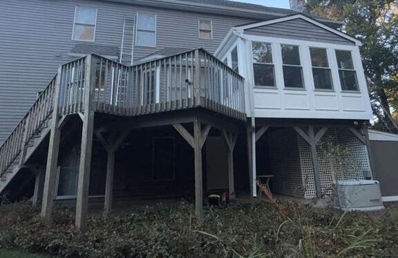 Complete rear elevation preparation and paint refresh on elevated deck supports and sunroom trim in Branford, CT
