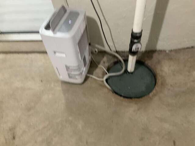 Covered Sump Area Near Basement Equipment