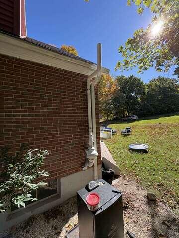 Exterior Radon Fan and Vent Pipe
