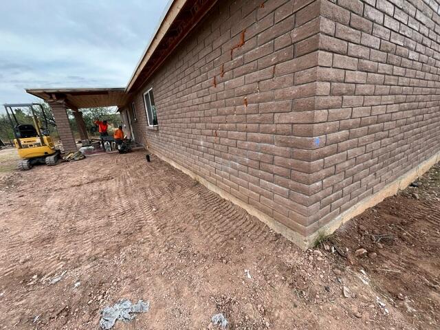 Helical Piers Installed Along the Home
