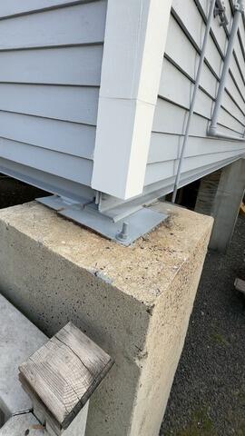 Clean structural post repair and foundation anchor reinforcement completed for long-term stability.