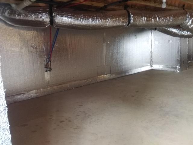 This crawl space was cold and cost the family extra on heating every month. Quality 1st Basement Systems installed SilverGlo crawl space insulation.