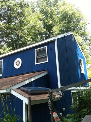 Blue Home on the River in Sandy Hook