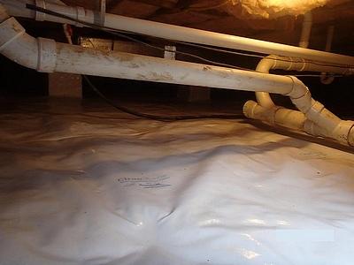 Tucked up under the pipes