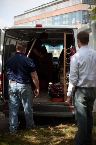 Bob and Jack look into a truck