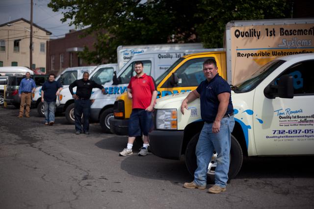 Each team member stands with his own truck
