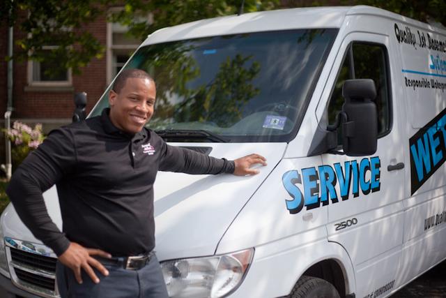 Sha-Chon smiles next to his clean truck.