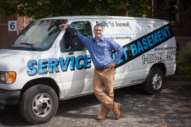 Our newest team member, Collin, smiles with his truck.