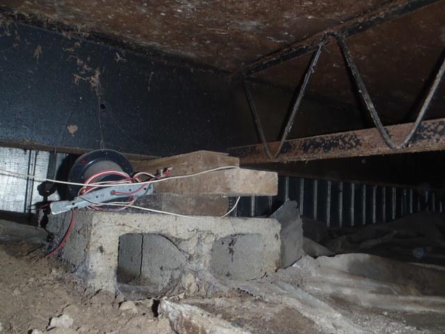 The plastic barrier in this image was originally installed with the goal to prevent moisture from rusting the metal foundation and structure of this crawl space. We will install our CleanSpace® Crawl Space Encapsulation System® in this Millsboro, DE crawl space to further prevent rust and structural damage. The vinyl barrier and dehumidifier will keep the moisture away from the metal. Contact Dr. Energy Saver today to schedule your free inspection and estimate with one of our certified inspectors!