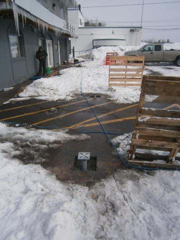A deck pier installed on a snowy Duluth day