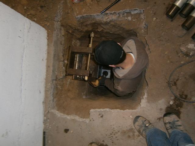 The depth the guys have to dig to get under the footings are amazing! It is pretty impressive when a guy gets in a hole that is almost as deep as he is tall. This was for installing helical piers in Rice Lake, Wisconsin.