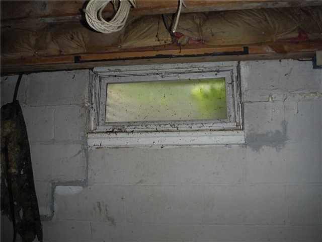 Leaking Window in Crumbling Basement