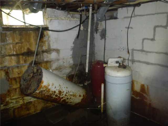 Mold and Rust Engulf Corner of Basement