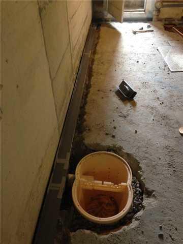 Sump Pump Being Installed