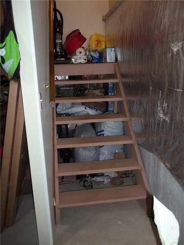 Some great before pics of the stairs followed by some great after pics where Adirondack Basement Systems enclosed underneath and included an access door in this Albany, NY home.