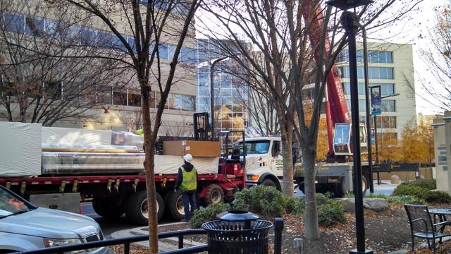 Crane and material truck