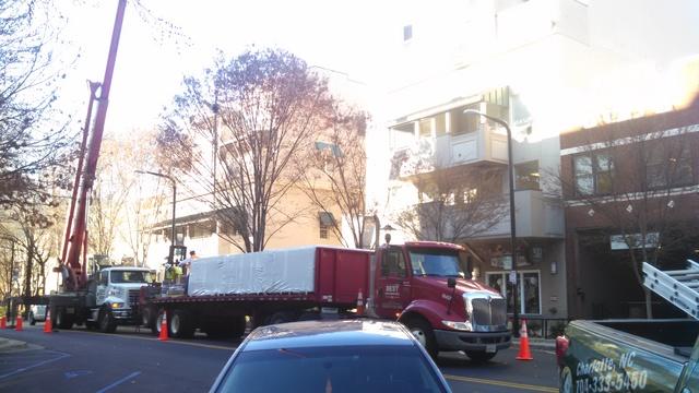 Crane and material truck