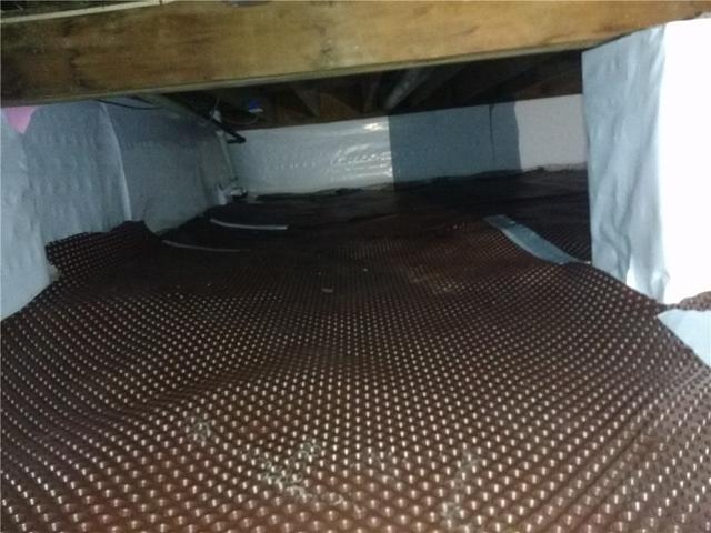 <p>Quality 1st Basement Systems laid down drainage matting to keep moisture from coming up through the dirt floor.</p>