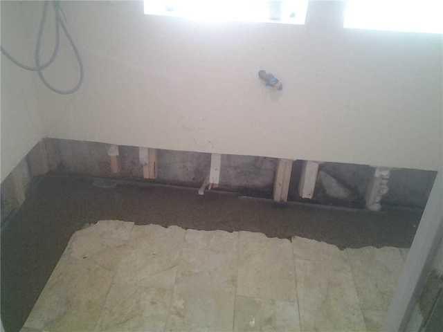 <p>After the drain was installed, it was covered up with a layer of concrete.</p>