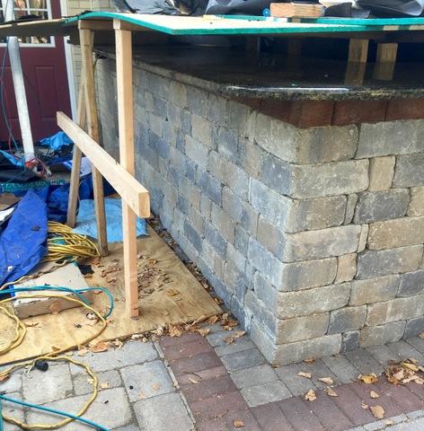 We built a fortress over the outdoor kitchen to protect the Granite counter top and stainless steel sink