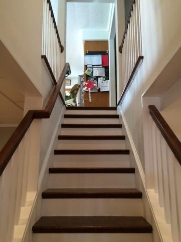 The last phase for our Upstate TBF team after finishing the basement area was to install this beautiful custom staircase that featured matching railings. The chosen colors of the risers and treads complemented the railing spindles to give it that "open air" feel as you decend the staircase.