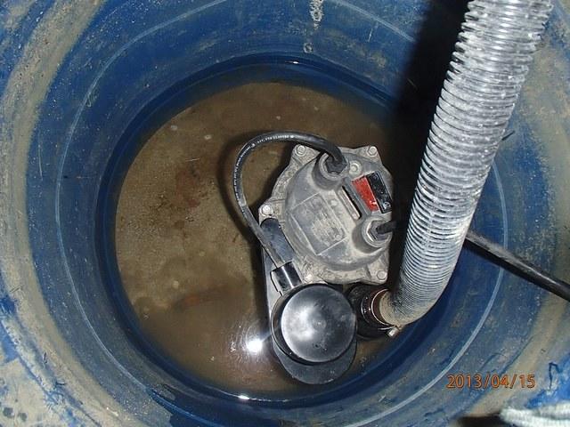 Standing water in the crawlspace sump pump container